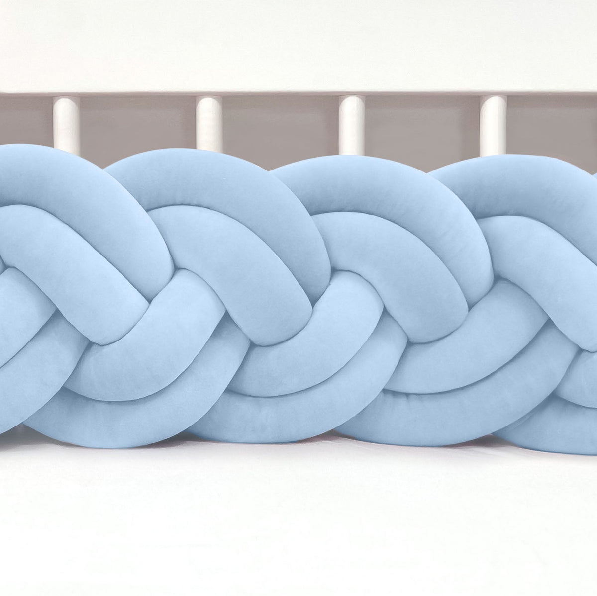 Braided light blue fabric on a white background