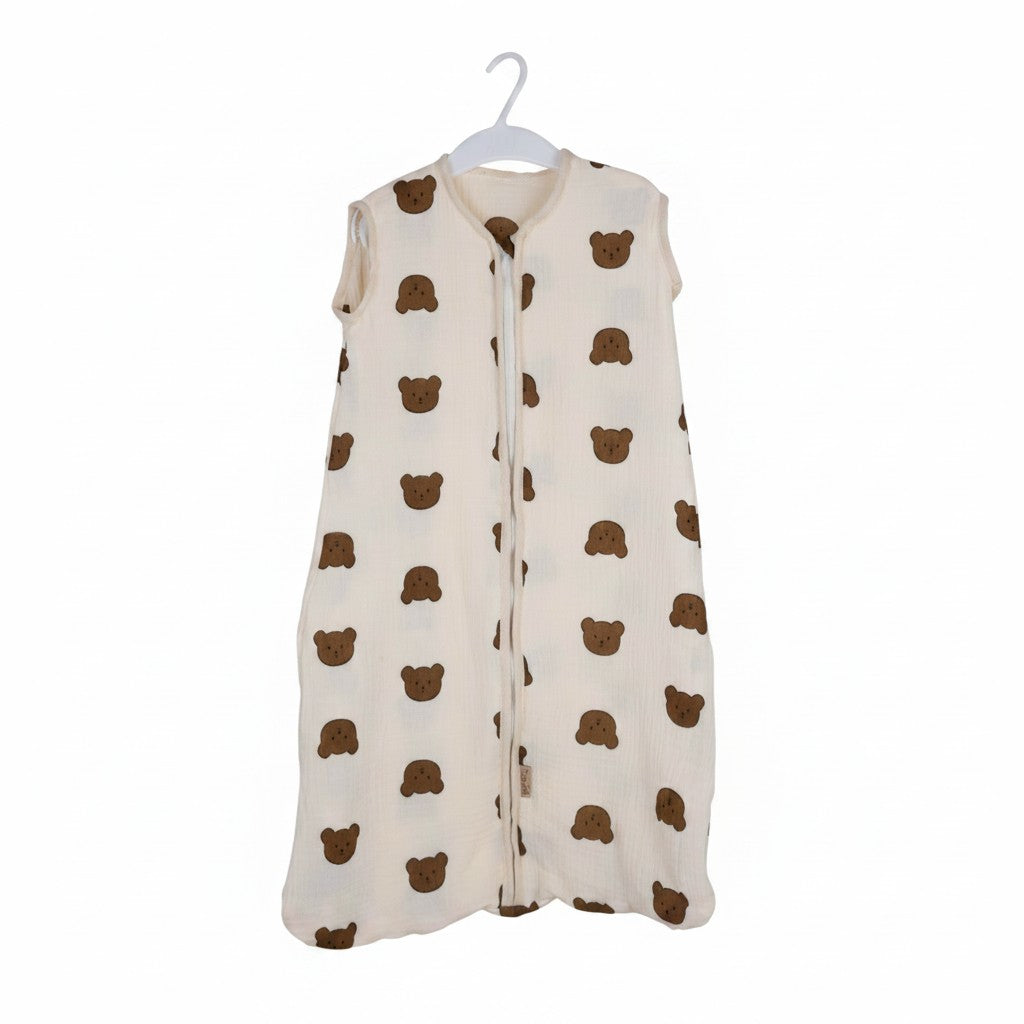 Baby Natur cream muslin sleeveless sleeping bag with brown bear print. Zipper closure.