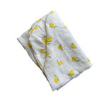 Baby Natur white 100% cotton crib sheet with a yellow lemon print. Soft, breathable, and washable.