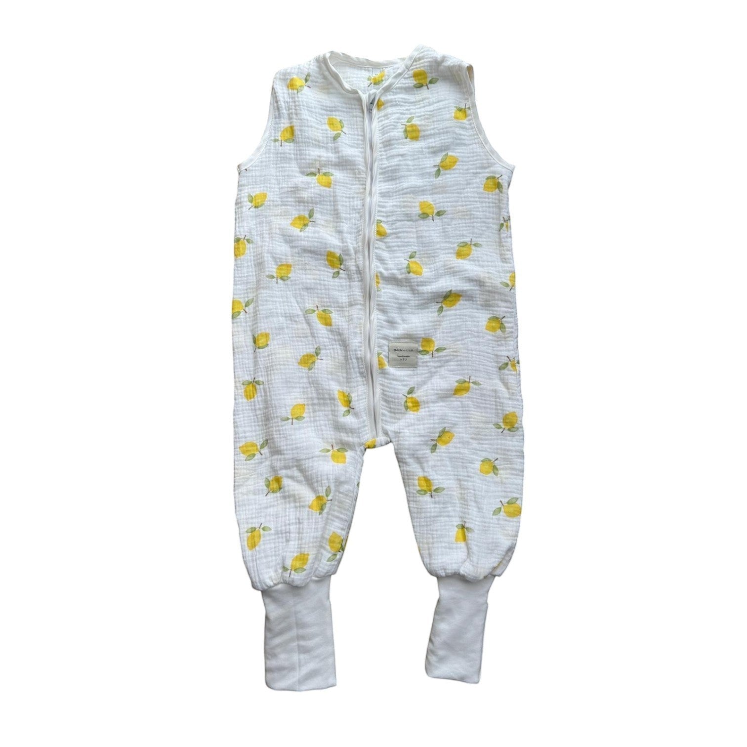 Baby Natur white muslin sleep sack with yellow lemon print, sleeveless with zipper and cuffed legs. OEKO-TEX certified.