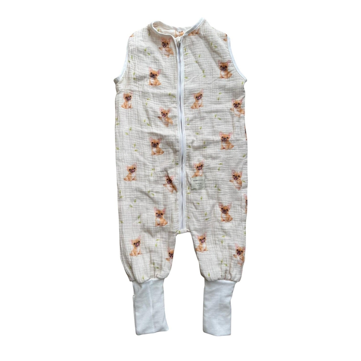 Baby Natur sleeveless muslin sleeping bag with a cute French bulldog print and green leaf accents. Features a zip closure and ribbed cuffs.