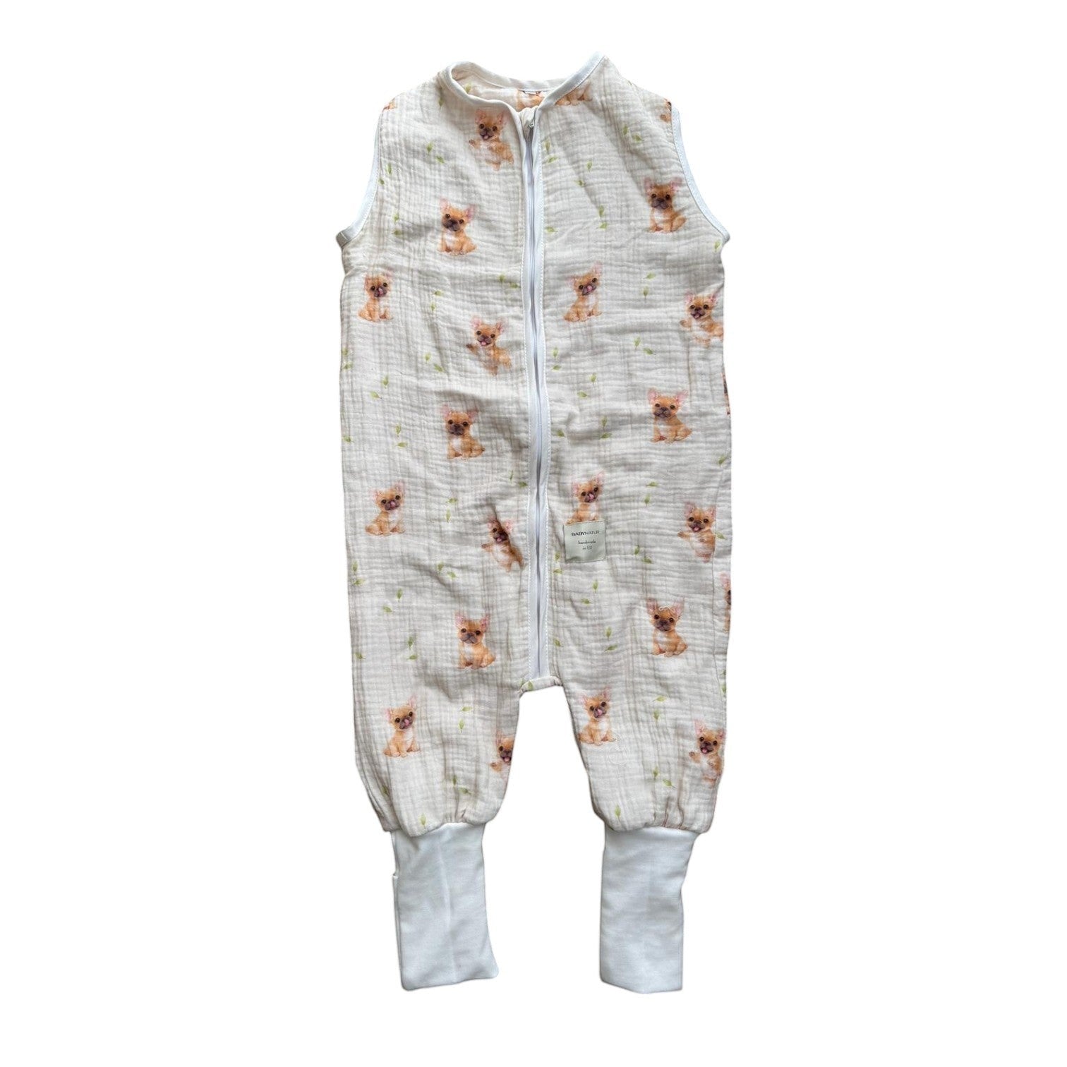 Baby Natur sleeveless muslin sleeping bag with a cute French bulldog print and green leaf accents. Features a zip closure and ribbed cuffs.