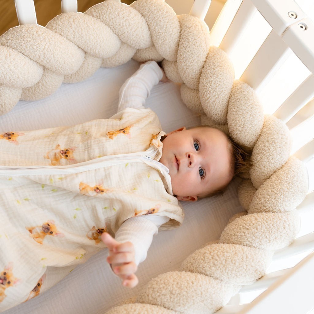 Baby Natur sleeveless sleeping bag in cream with a cute dog print, made from soft, breathable cotton for safe sleep.