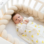 Baby Natur sleeveless sleeping bag with yellow lemon print, made of soft, breathable cotton. For safe and comfortable sleep.