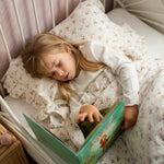 Baby Natur Tetra muslin bedding set with floral print and ruffled edges, 100% organic cotton.