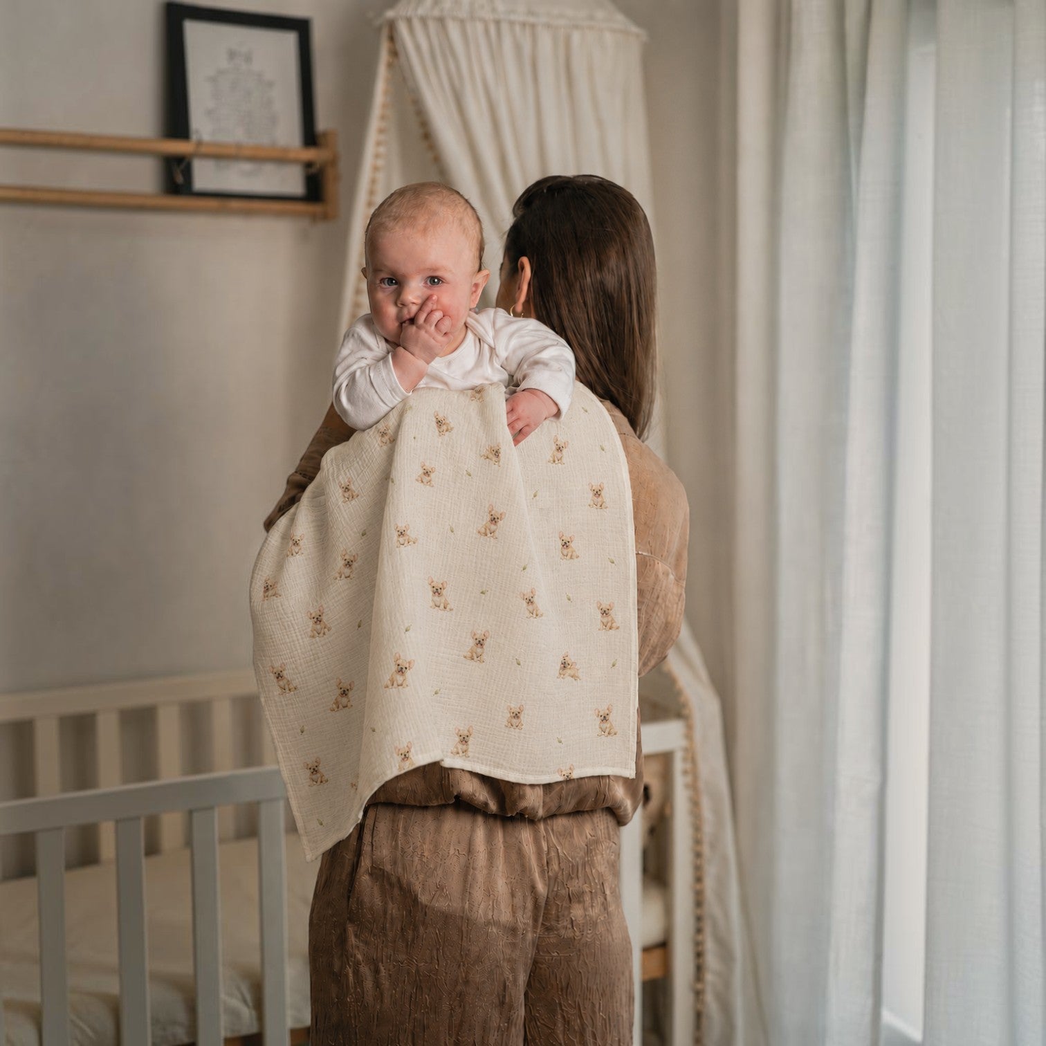 Baby NaturA 100% cotton muslin swaddle blanket with a French bulldog print, perfect for burping or as a crib liner.