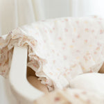 Baby Natur muslin blanket with a floral print and ruffled edges, perfect for cribs or strollers.