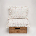 Baby Natur Tetra muslin bedding set with a floral print and ruffled edges. Made from 100% organic cotton.