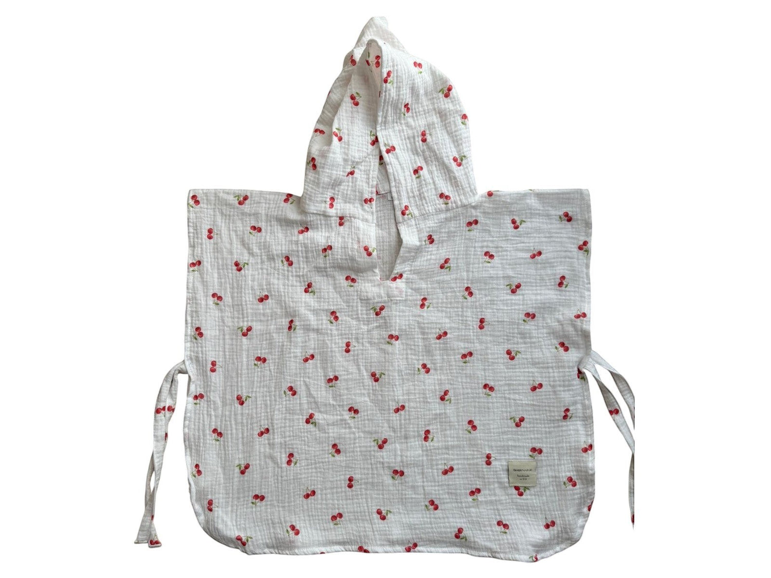 Baby Natur white muslin hooded poncho with a red cherry print and side ties.