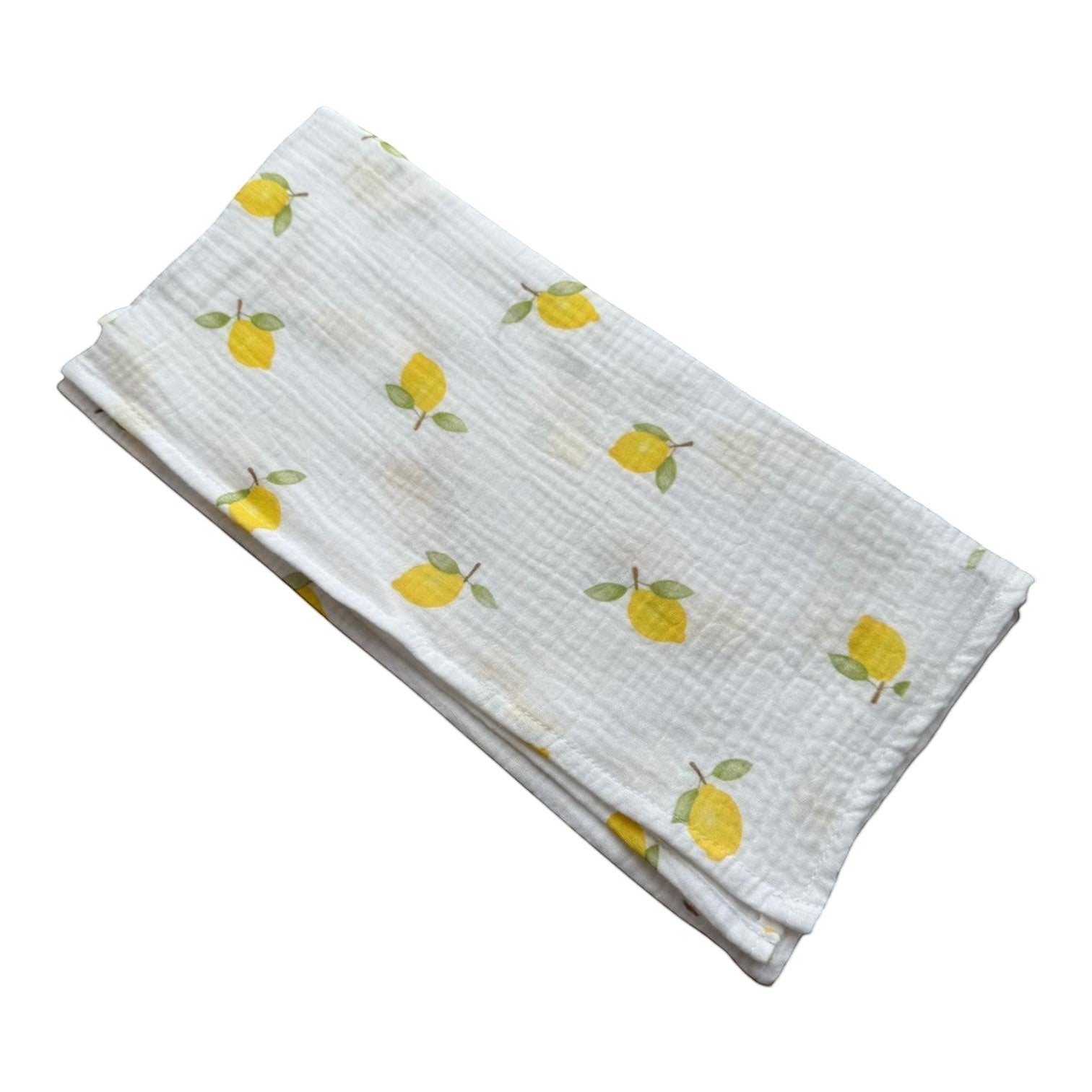 Baby NaturStandard tetra diaper with a white background and a pattern of yellow lemons and green leaves. 100% cotton.