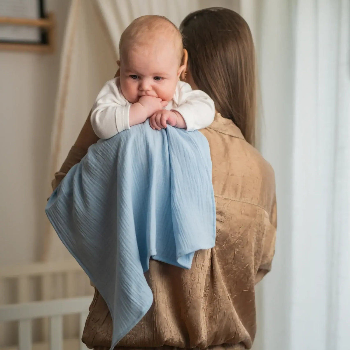 Baby NaturHere light blue 100% cotton muslin tetra diaper for burping, changing, or as a crib liner.
